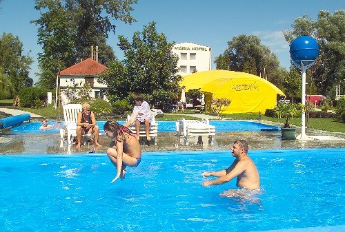 The three stars Hotel M�ria is located directly on the shore of Lake Balaton, in a beautiful landscaped environment. In the hotel a restaurant, a drink bar and 2 conference rooms (each for 50 people), in the park basins for children and for adults and an own beach welcome the guests.